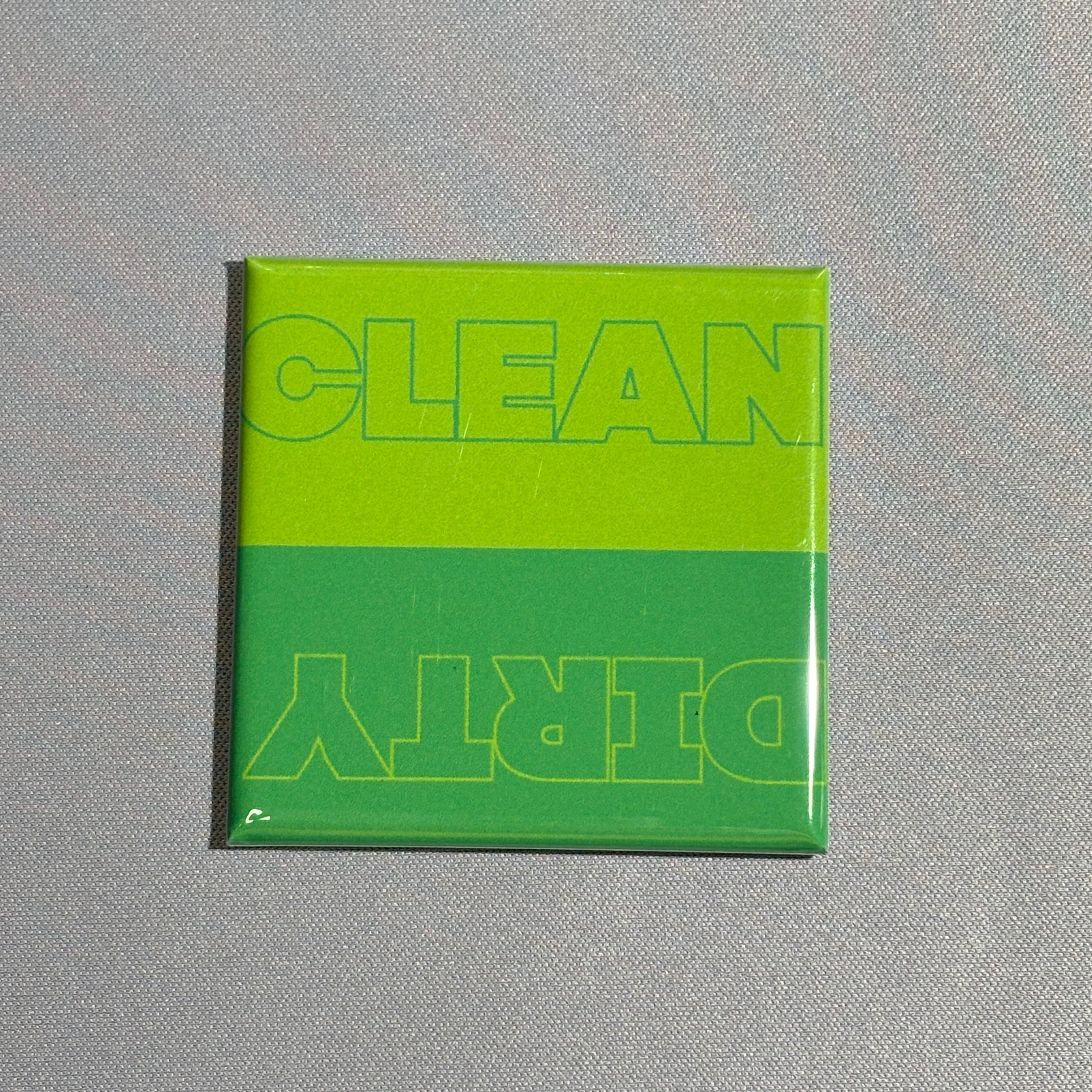 A square magnet with the words clean and dirty on top in a green color variation. Used for dishwasher.